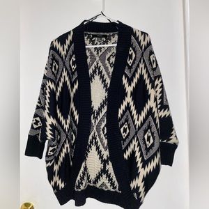 Black and cream colored knit sweater